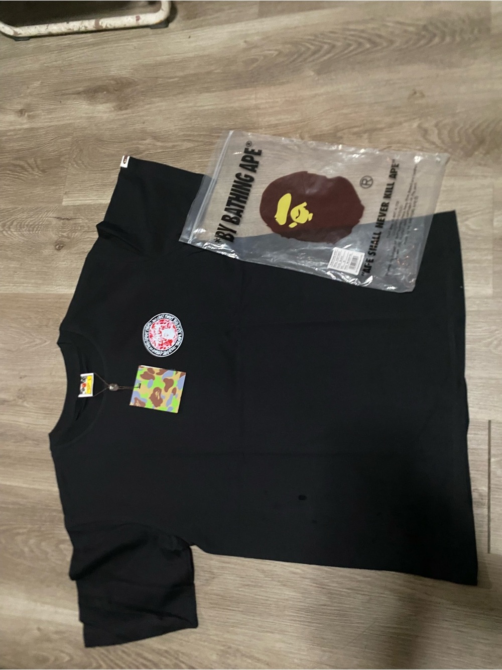 BAPE x Stüssy T-Shirt with pink and white graphic on front and back of t-shirt